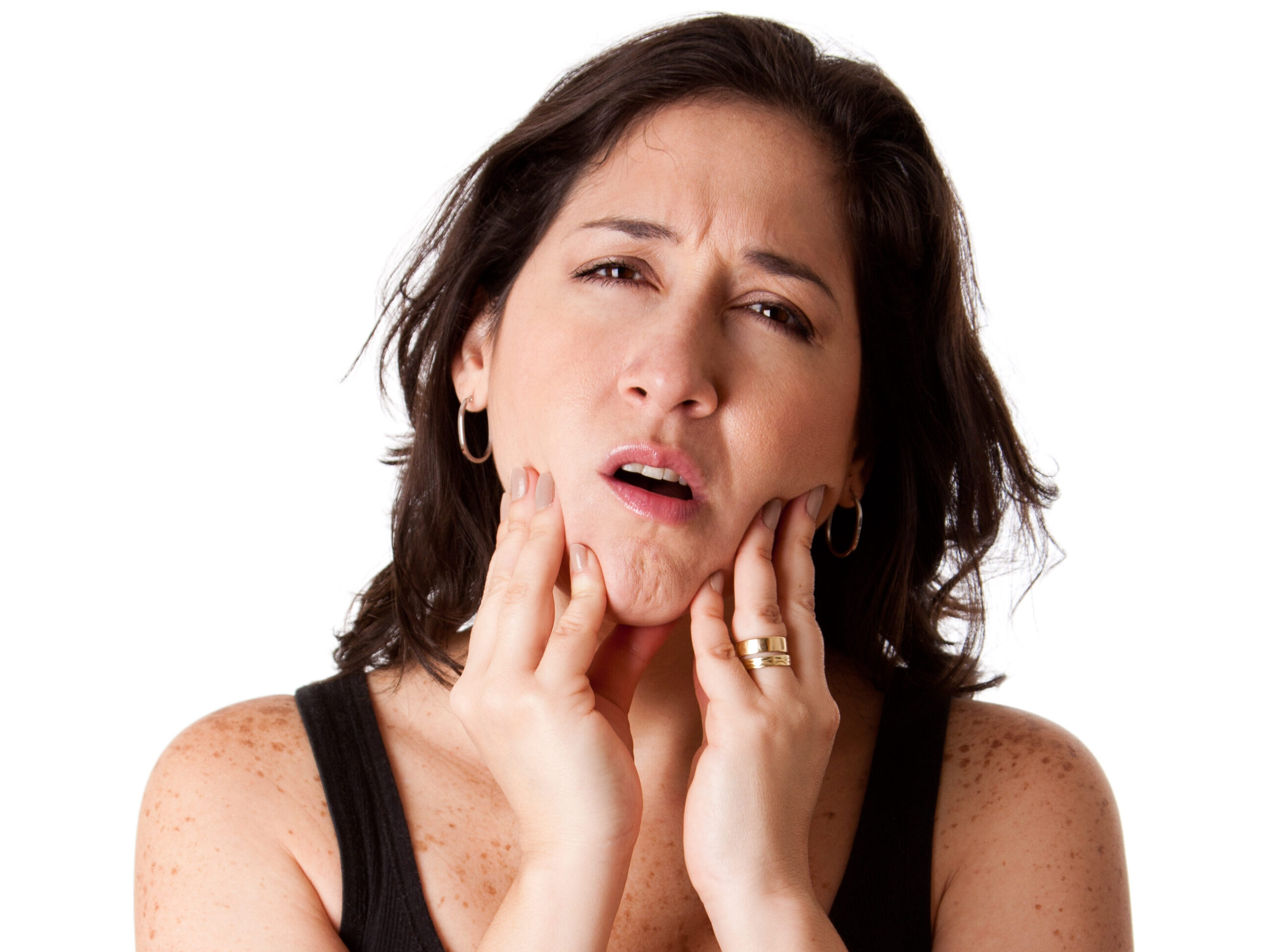 Beautiful young attractive woman with dental tooth jaw pain expression feeling unwell, holding her chin.